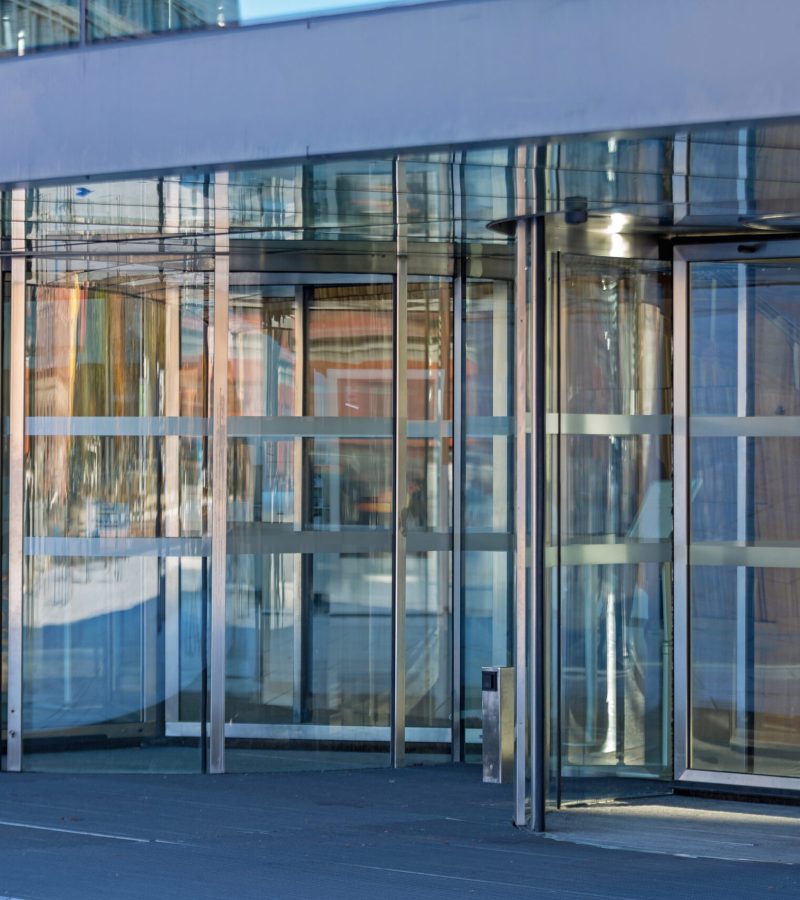 automatic-revolving-doors-at-modern-building-entra-2025-10-06-20-18-35-utc