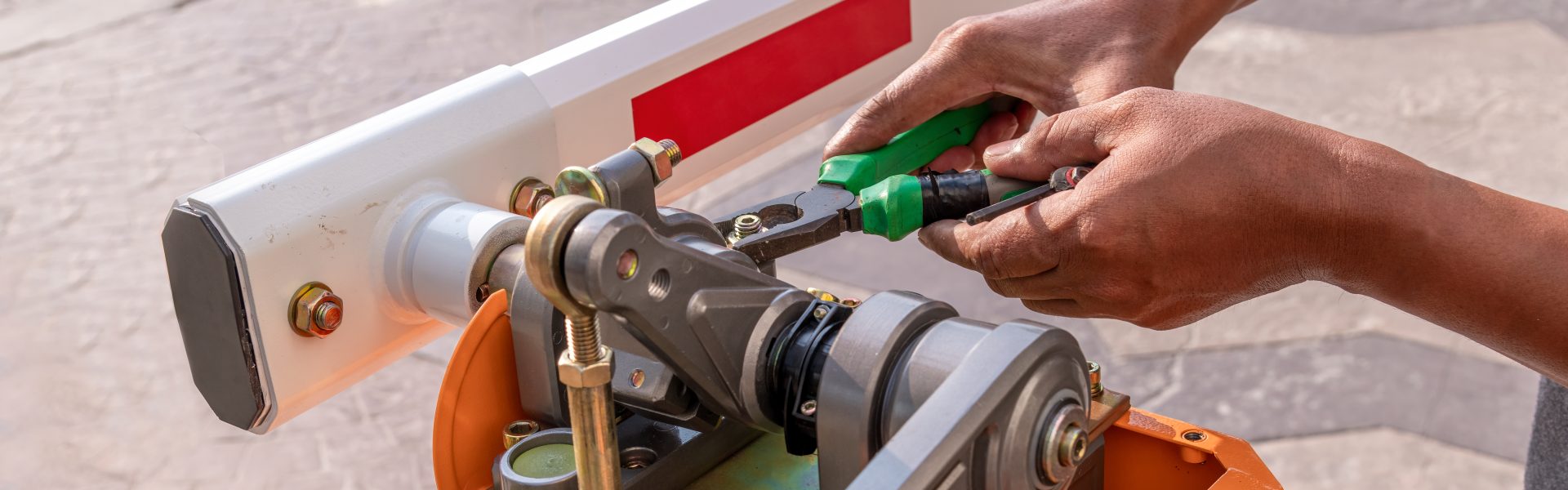 close-up-technician-assemble-barrier-gate-automati-2025-03-15-02-49-33-utc