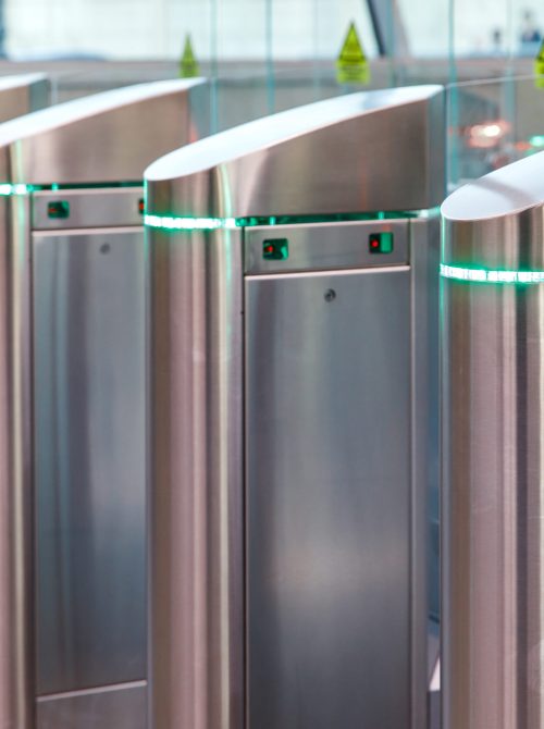 Close up of modern turnstiles for the passage of subway trains transport/ railway station, inside. Entrance in metro with electronic card access.